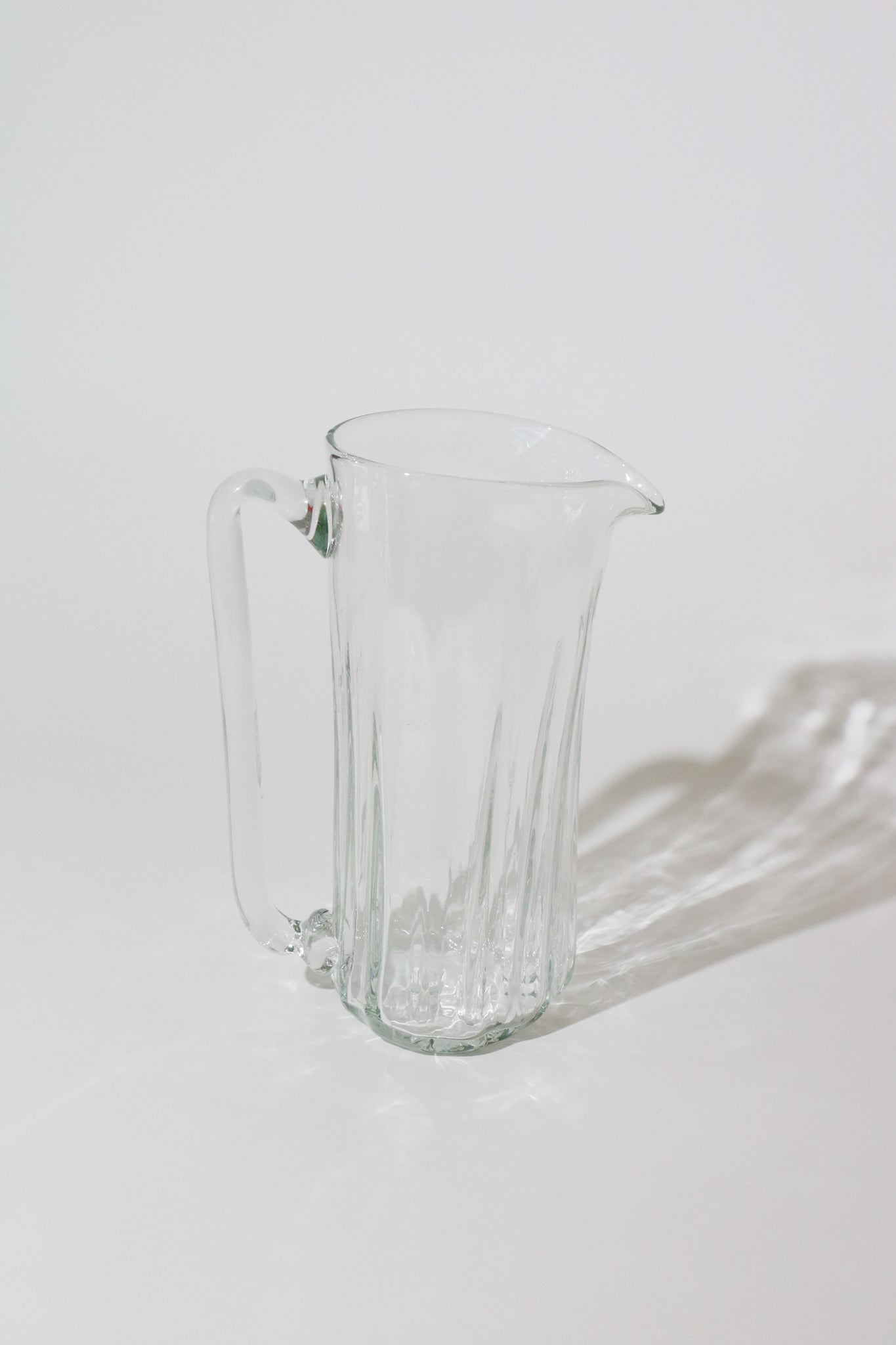 http://shopsommer.com/cdn/shop/products/Xaquixe-Tall-Glass-Pitcher-2.jpg?v=1680822257
