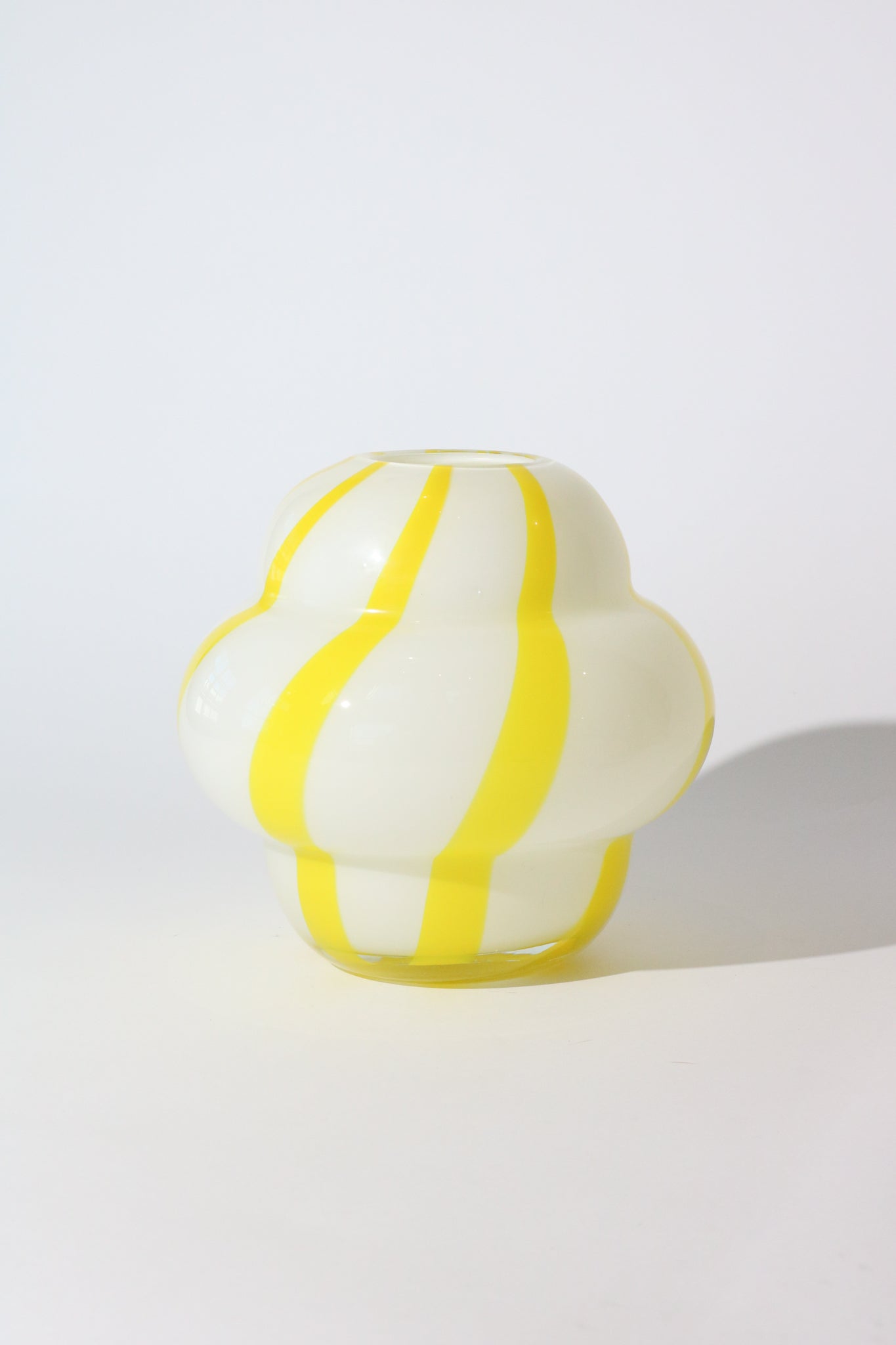 http://shopsommer.com/cdn/shop/products/byon-curlie-vase-yellow-white-shop-sommer-curated-home-goods-4.jpg?v=1677800080