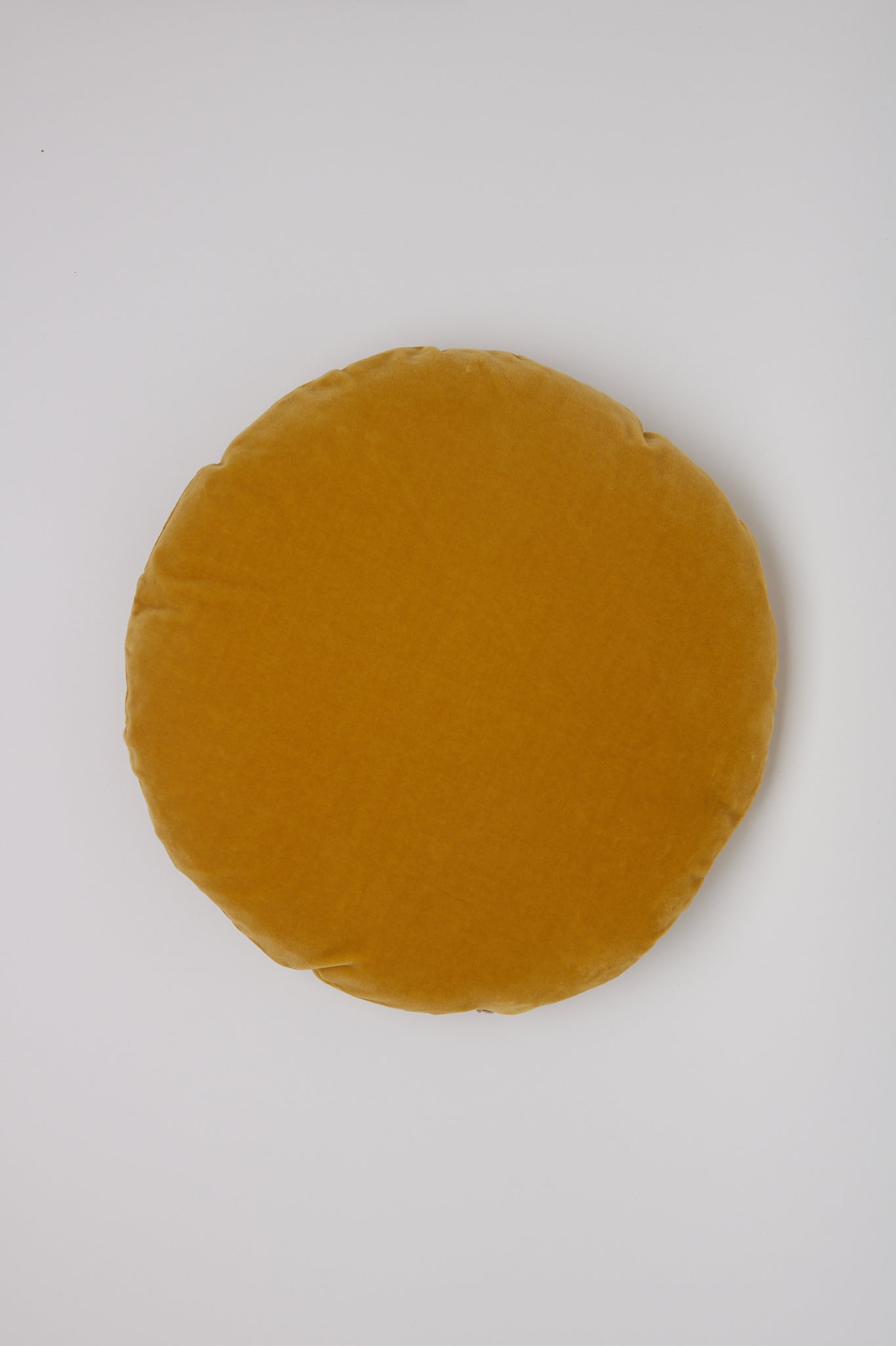 Christina Lundsteen Basic Round Cushion in Mustard, curated by Shop Sommer in San Francisco.