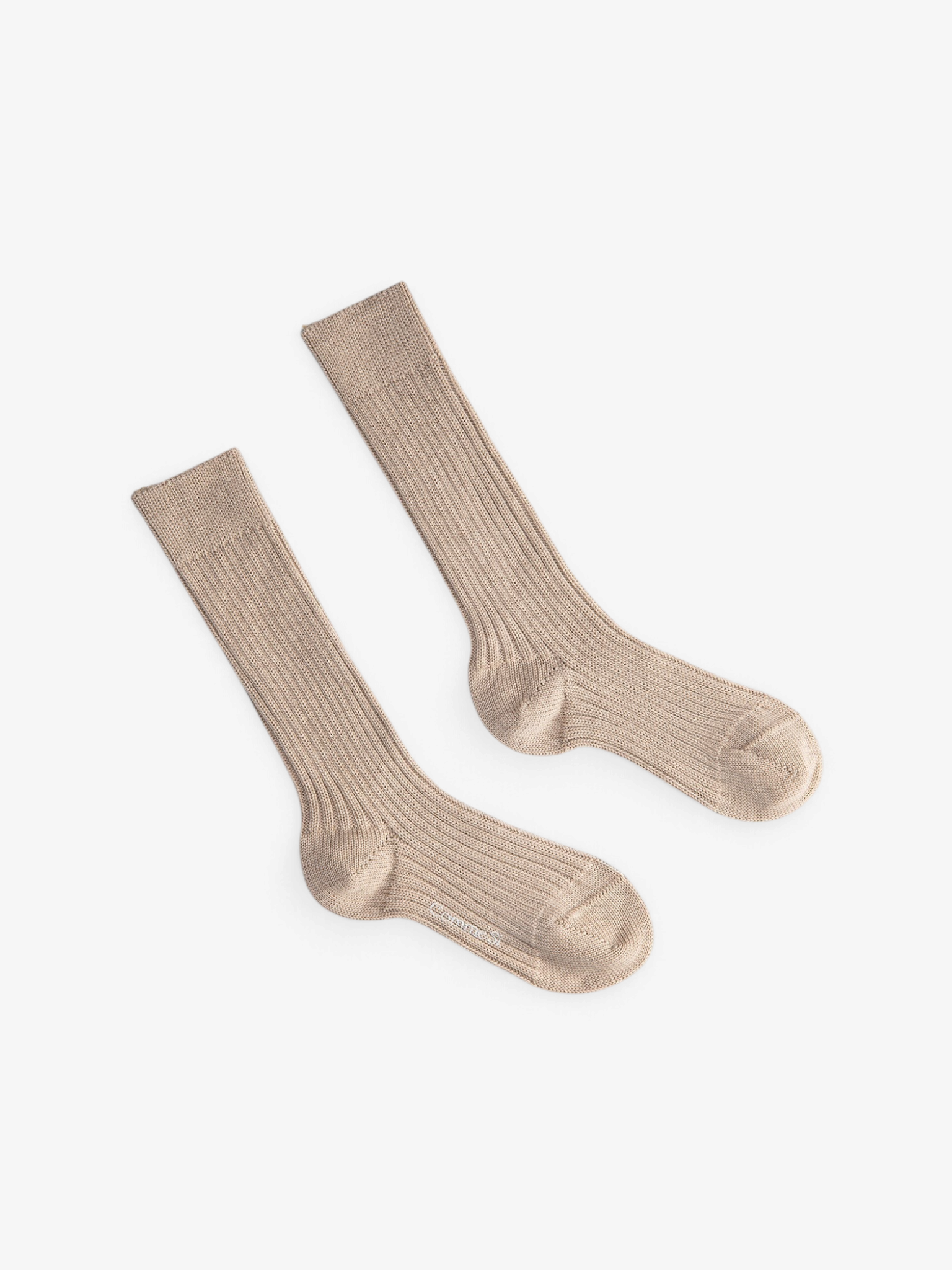 Sommer Merino Chunky Sock in beige, a thick ribbed knit mid-calf sock made in Italy for warmth and comfort.