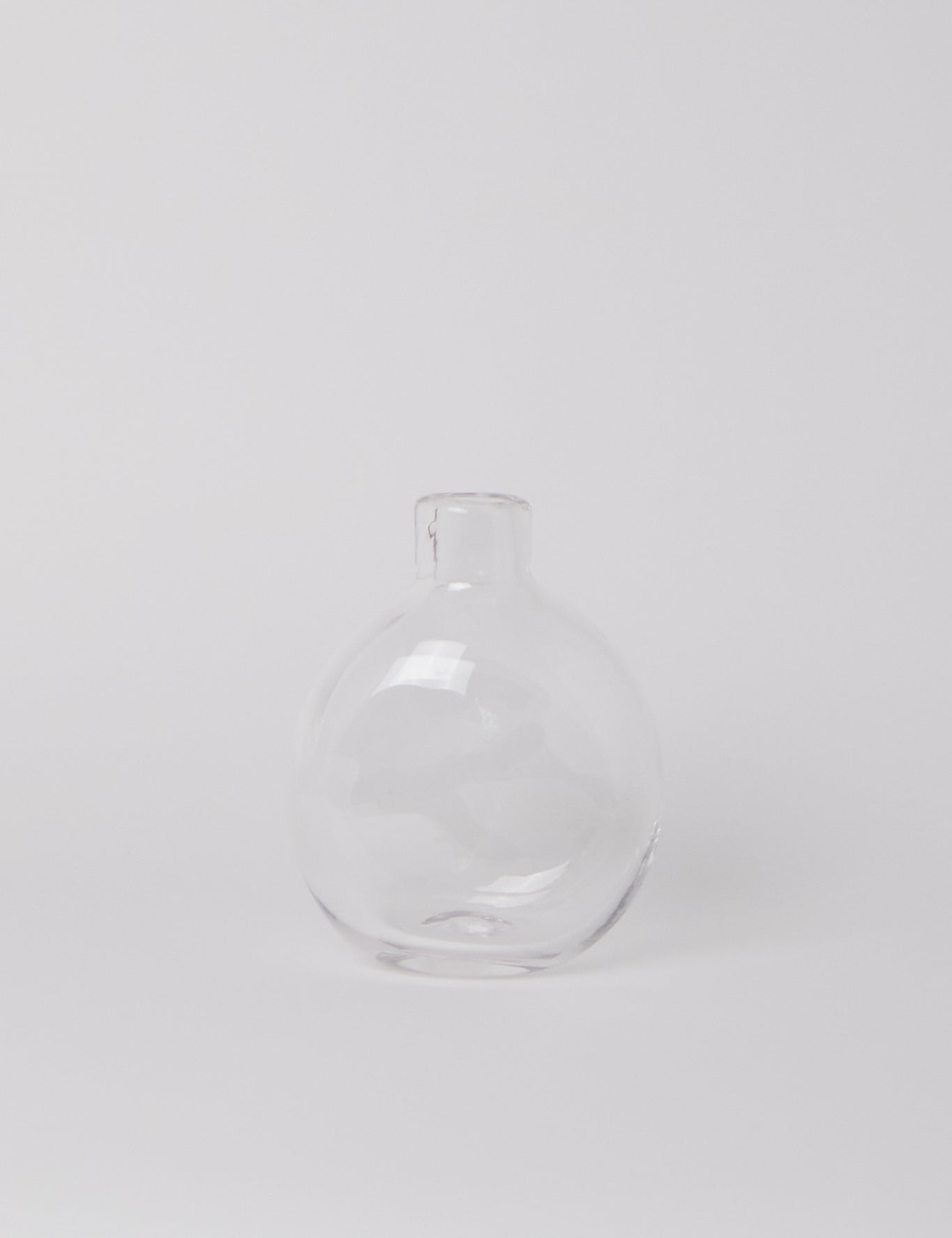 FRAMA Clear Round Glass Bottle, curated by Shop Sommer in San Francisco.