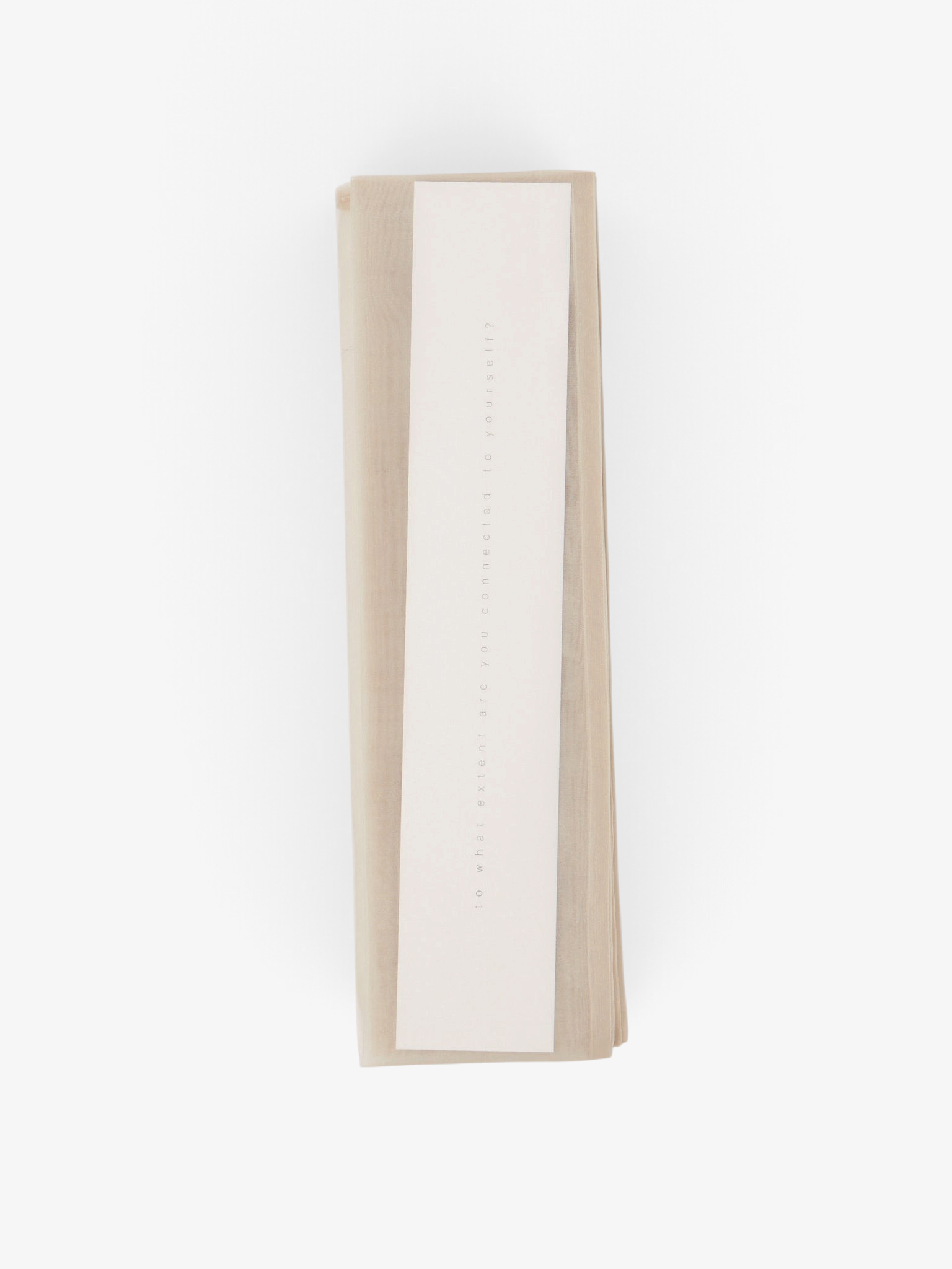 Sommer Iko Iko organza cord cover in a neutral beige tone, made from Japanese poly organza for home decor.