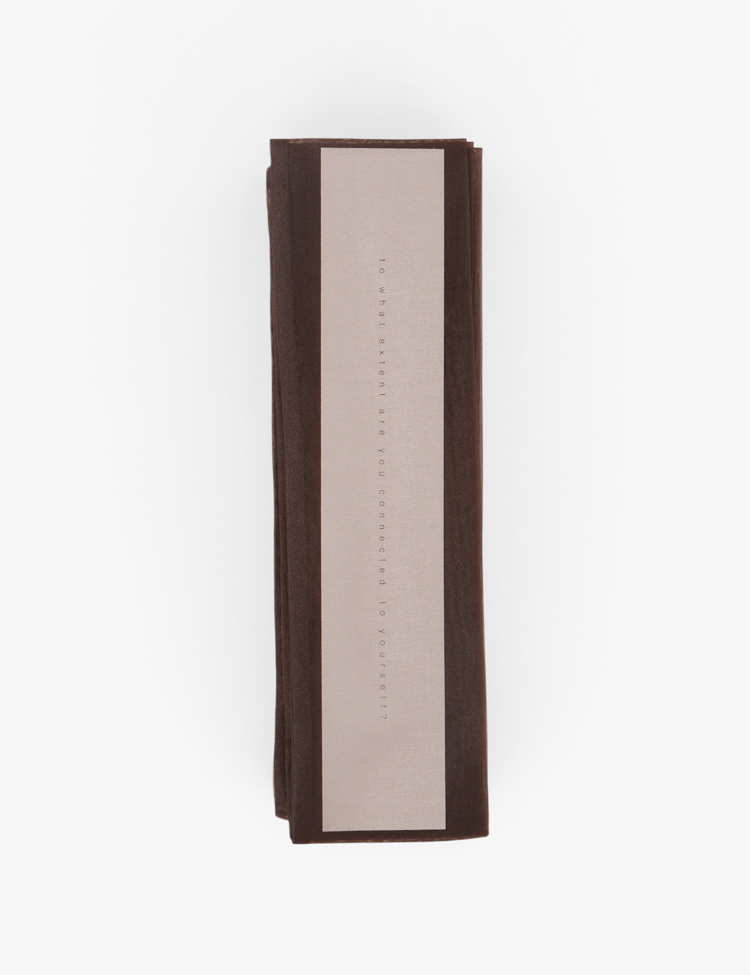 Sommer Iko Iko brown organza cord cover with printed text on a light background