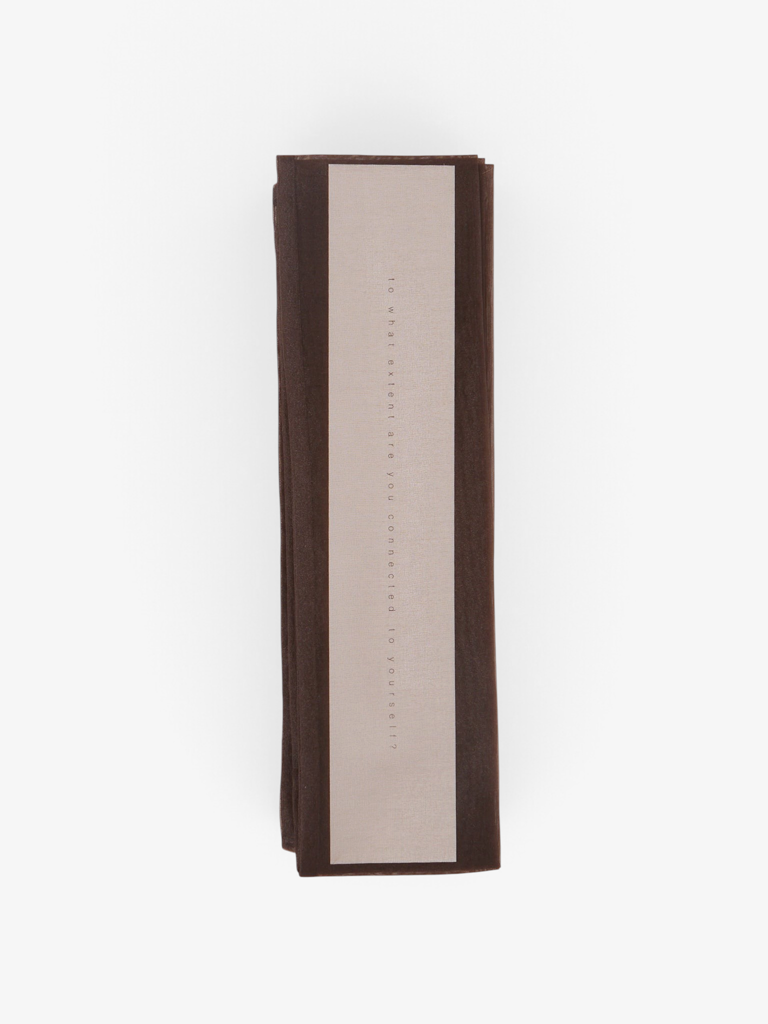 Sommer Iko Iko brown organza cord cover with printed text on a light background