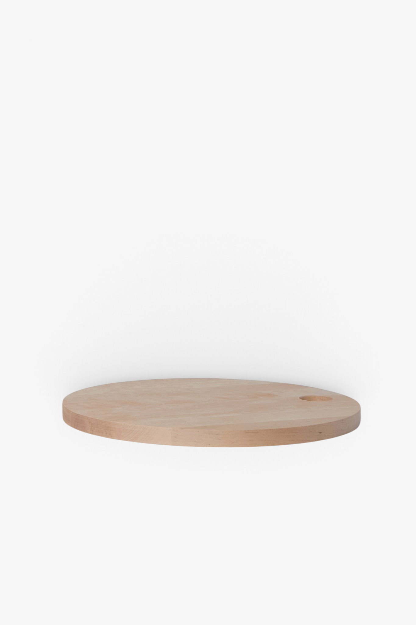 Iris Hantverk Round Birch Cutting Board, curated by Shop Sommer in San Francisco