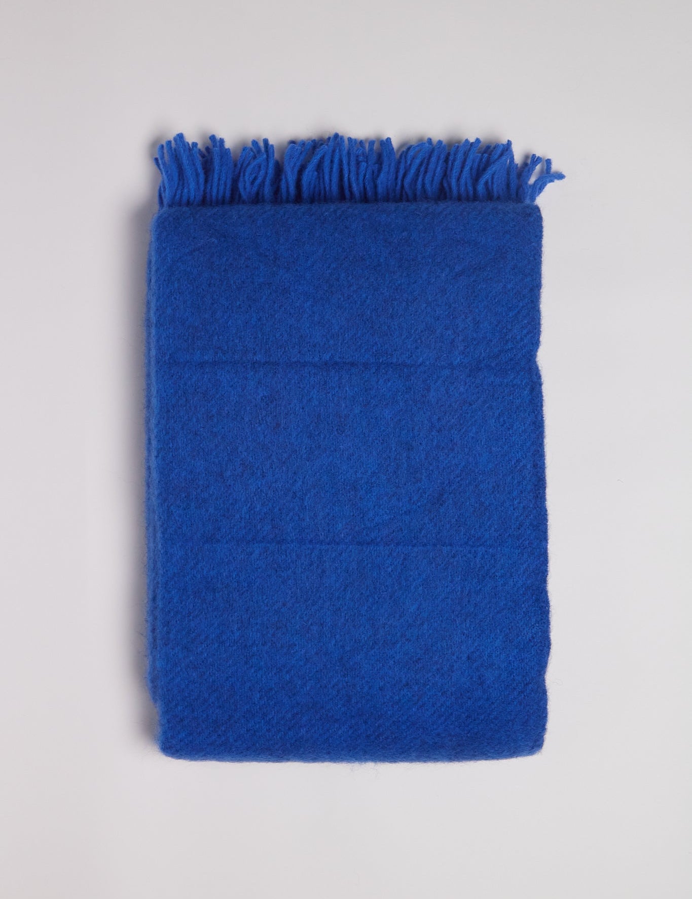 Klippan Gotland Wool Throw Blanket in Bauhaus Blue, curated by Shop Sommer in San Francisco.