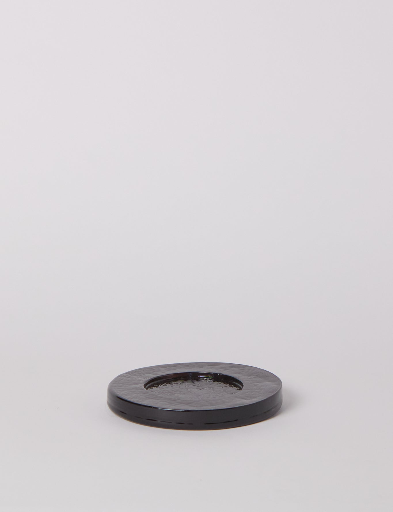 Nina Nørgaard Solid Glass Assiette Black, curated by Shop Sommer in San Francisco.