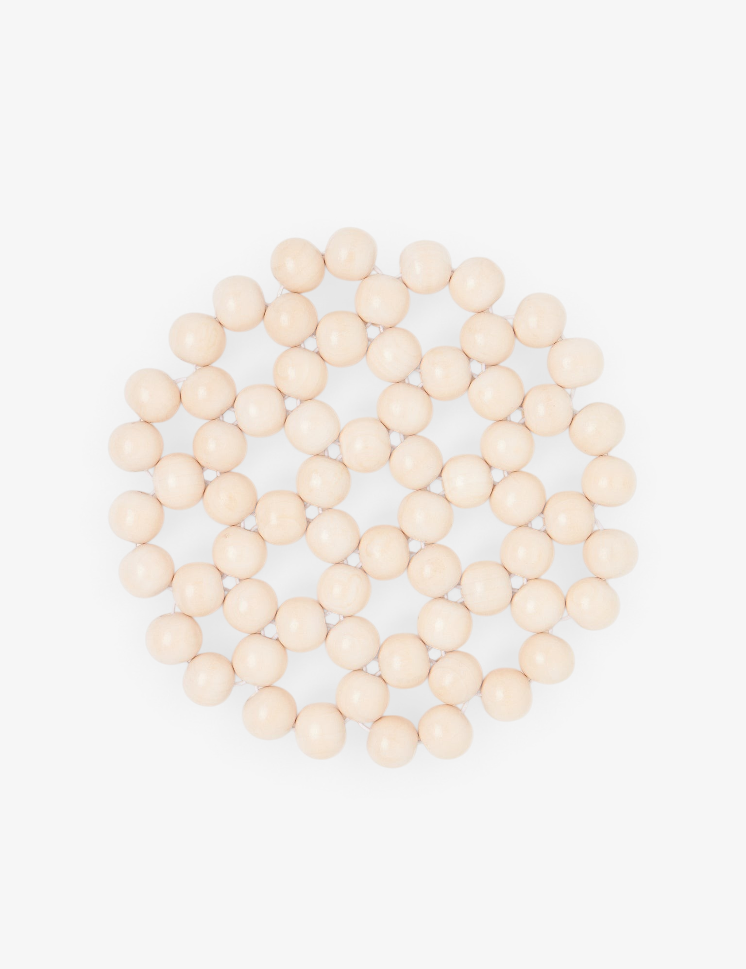 Sommer Larco Tofu beaded trivet featuring a circular pattern of cream-colored lacquered beads for heat protection.