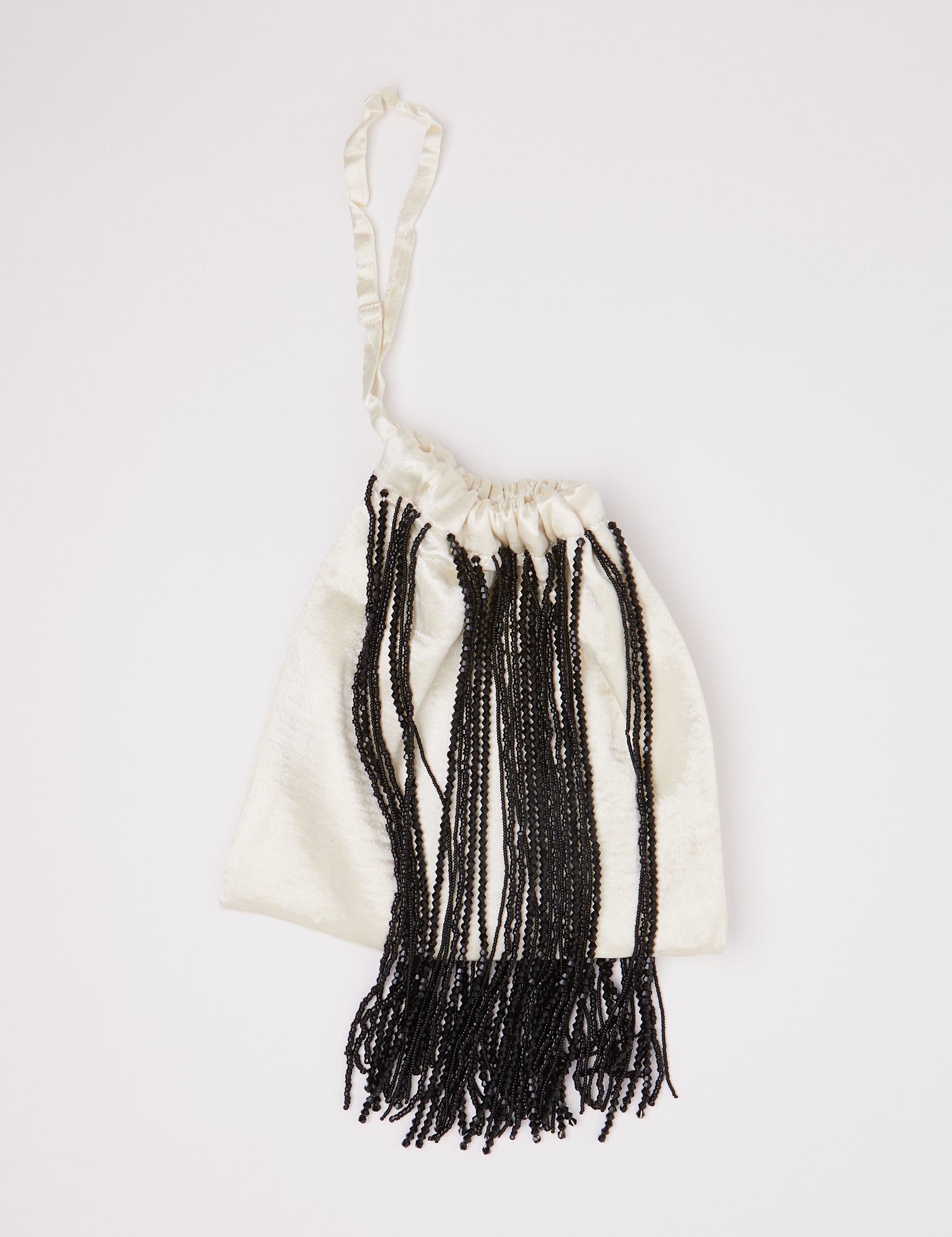 Tigra Tigra Beaded Fringe Wristlet Bag Pale Yellow, curated by Shop Sommer in San Francisco.
