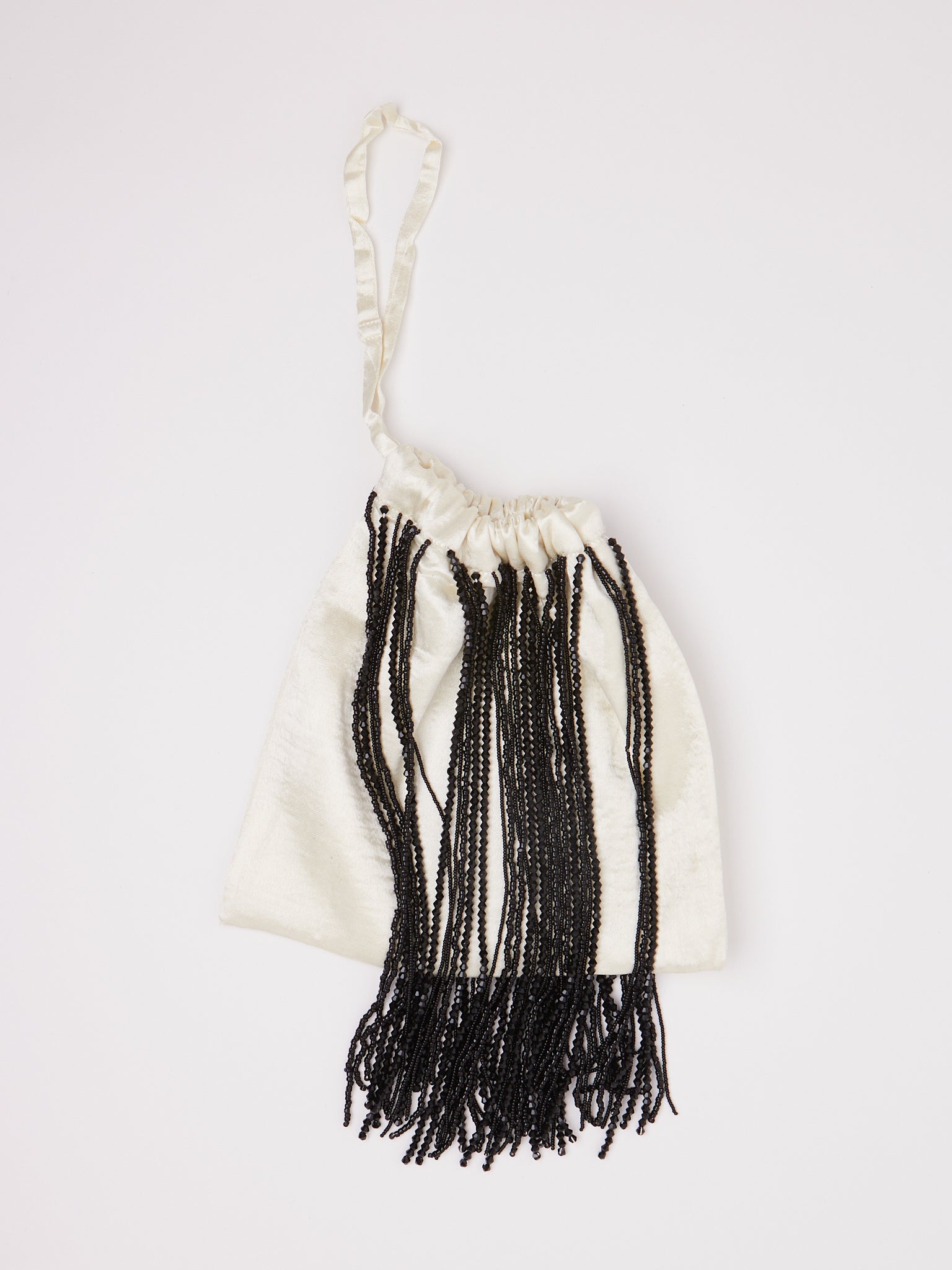 Tigra Tigra Beaded Fringe Wristlet Bag Pale Yellow, curated by Shop Sommer in San Francisco.
