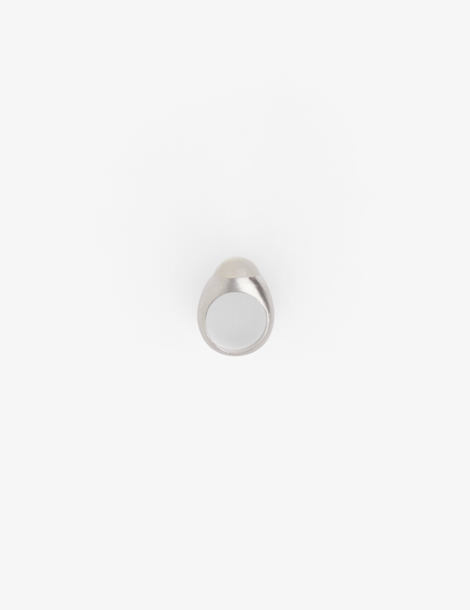 Sommer Dunton Ellerkamp sterling silver boulder ring featuring a smooth white moonstone, hand-carved design.