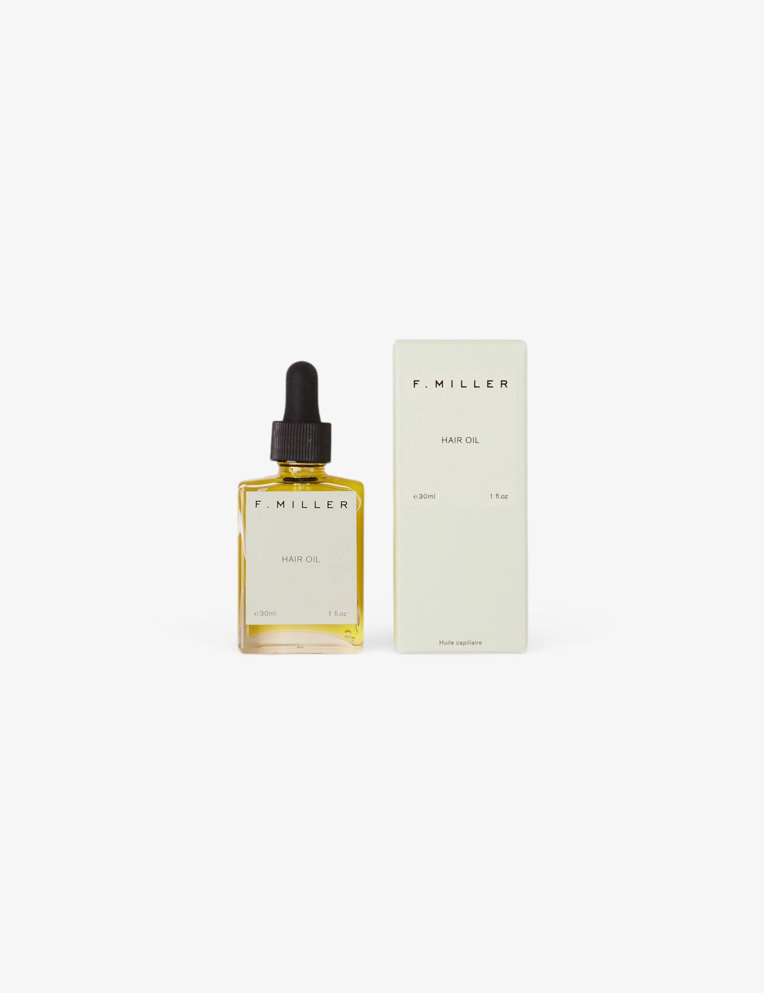 Sommer F. Miller Hair Oil in a glass dropper bottle with its light green packaging box on a neutral background.