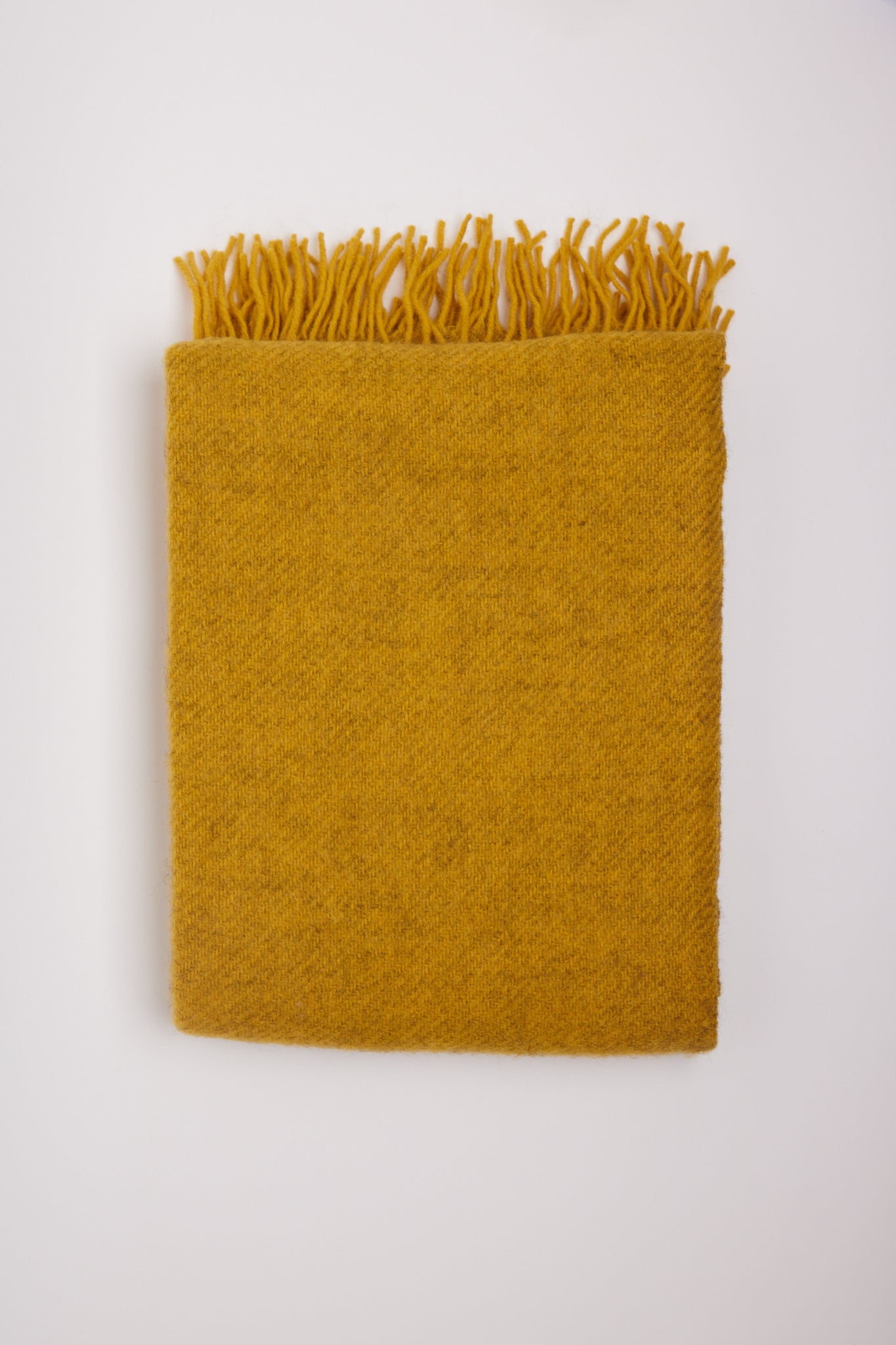 Klippan Gotland Wool Throw Blanket Yellow, curated by Shop Sommer in San Francisco.