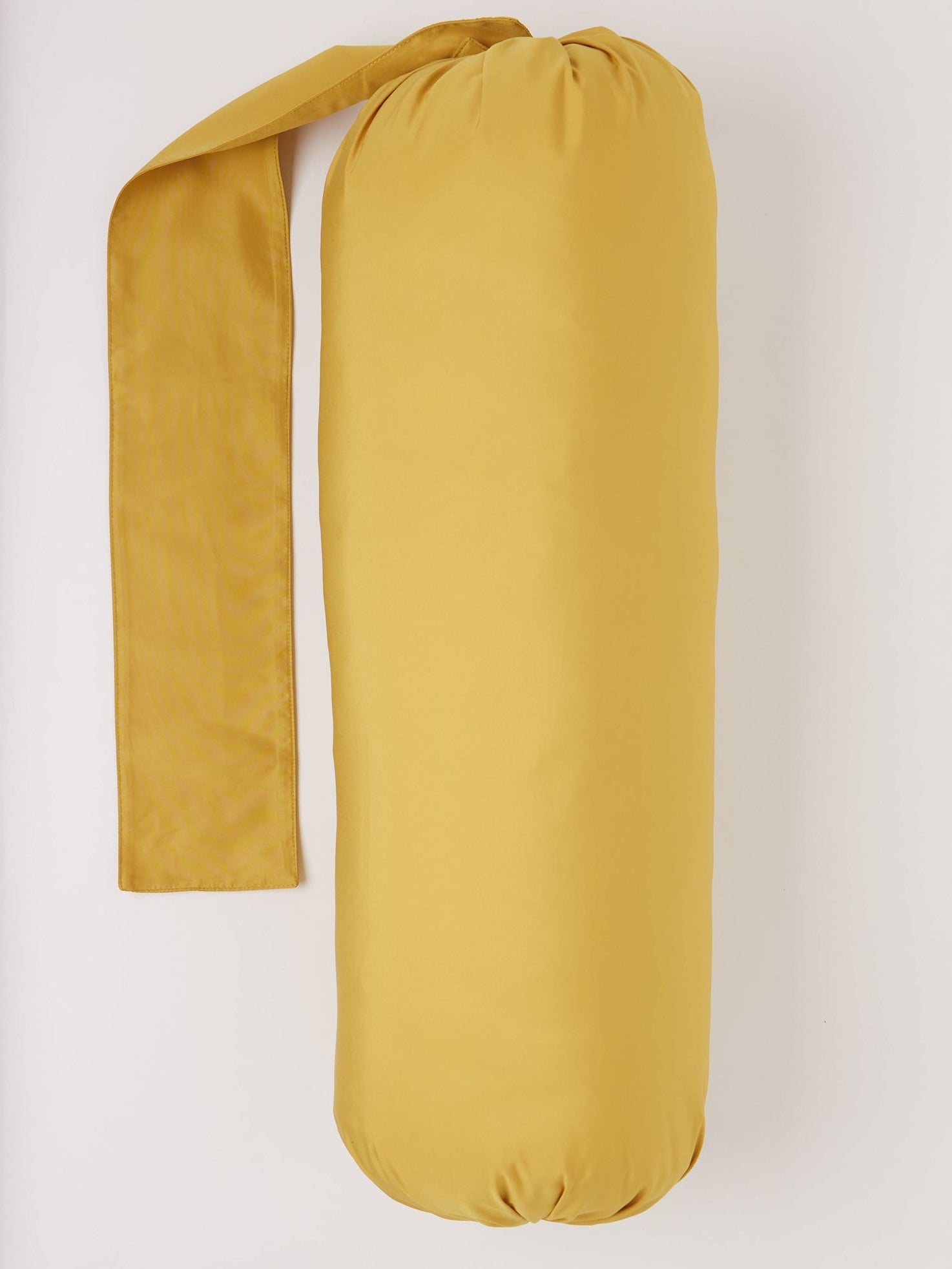 Pien Studios Ochre Bolster Pillow, curated by Shop Sommer in San Francisco.