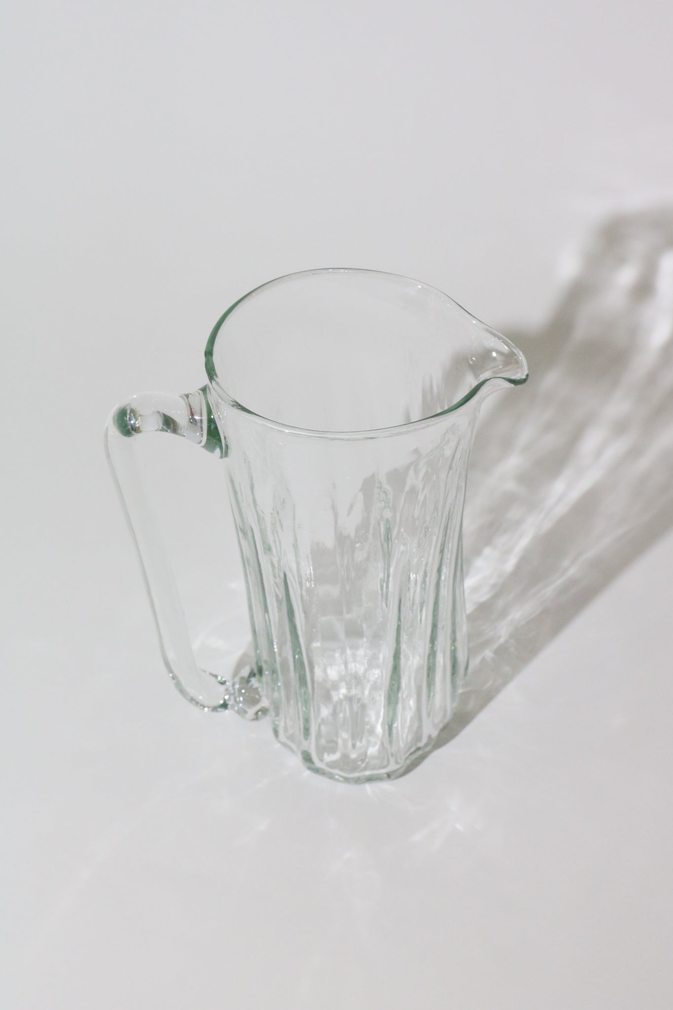 https://shopsommer.com/cdn/shop/products/Xaquixe-Tall-Glass-Pitcher-1.jpg?v=1675641540&width=2000
